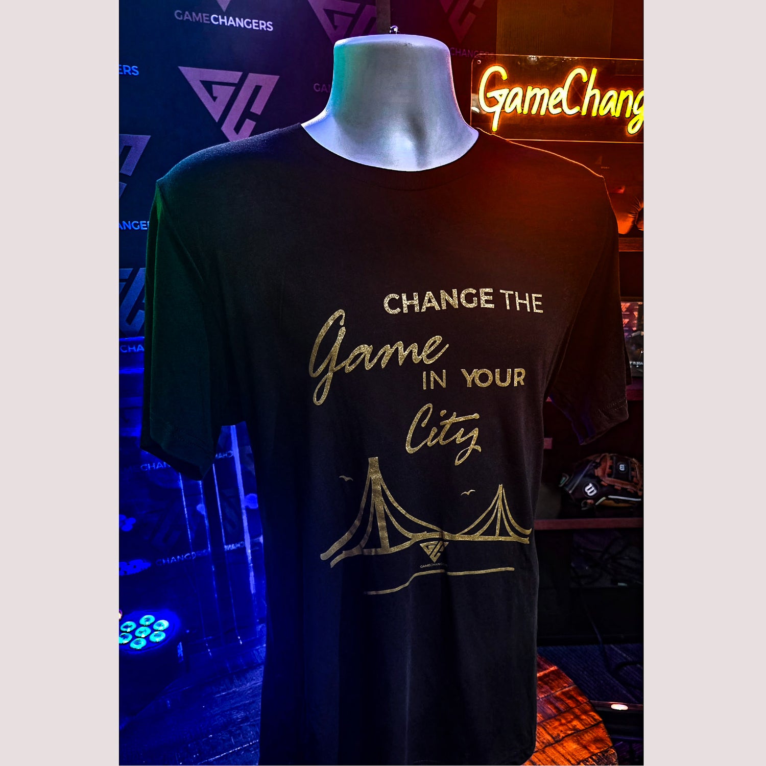 Black t-shirt with gold text and design