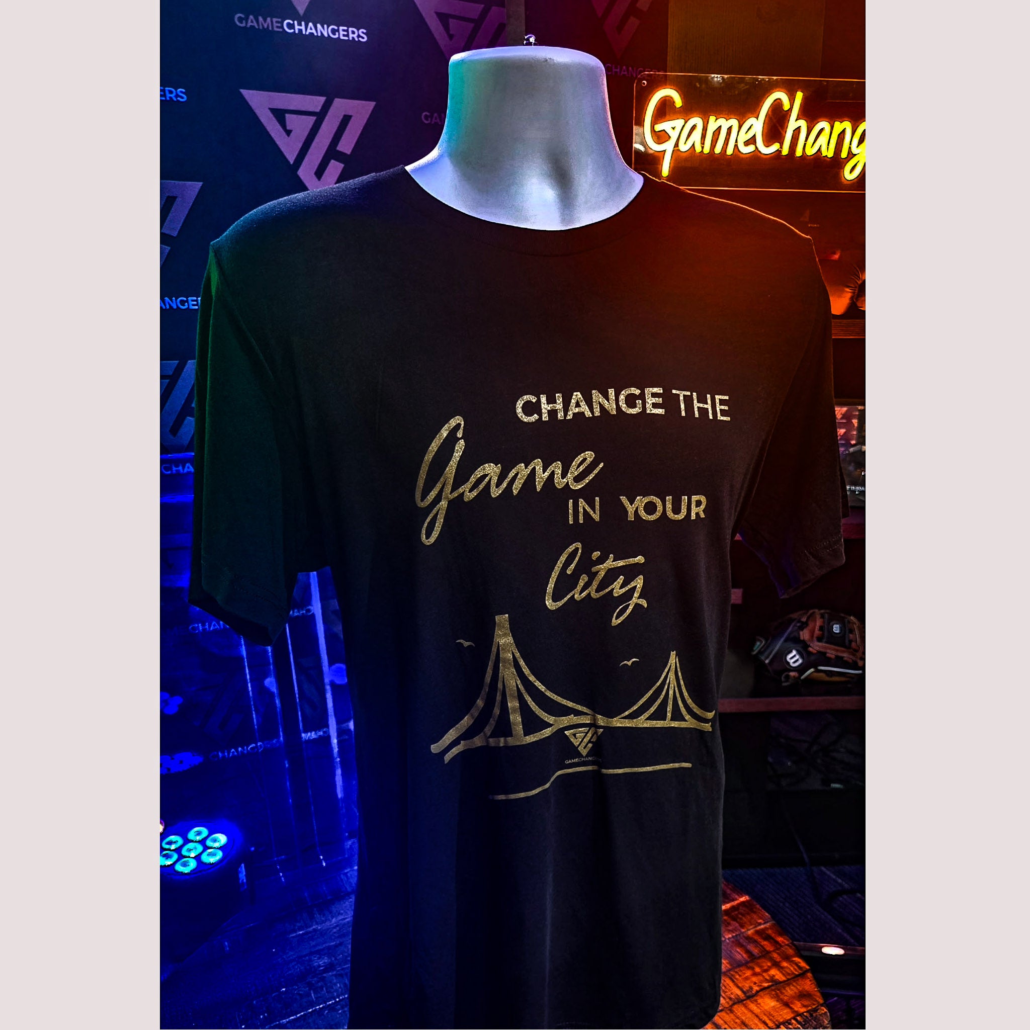 Black t-shirt with gold text and design